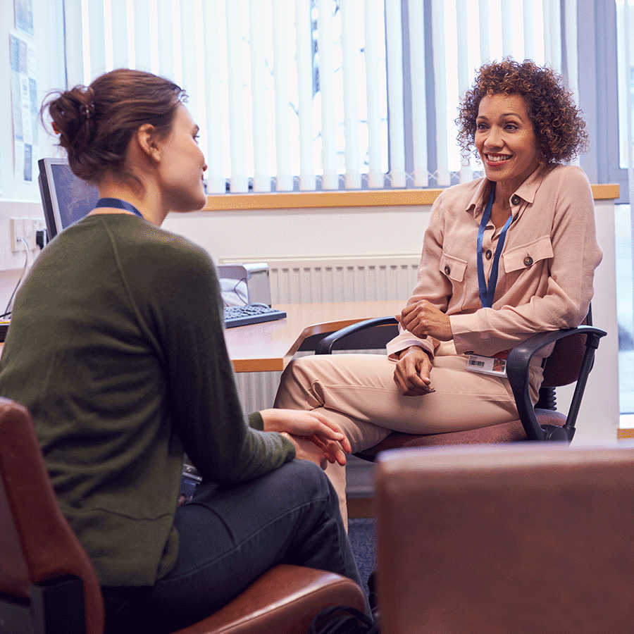 two staff talking